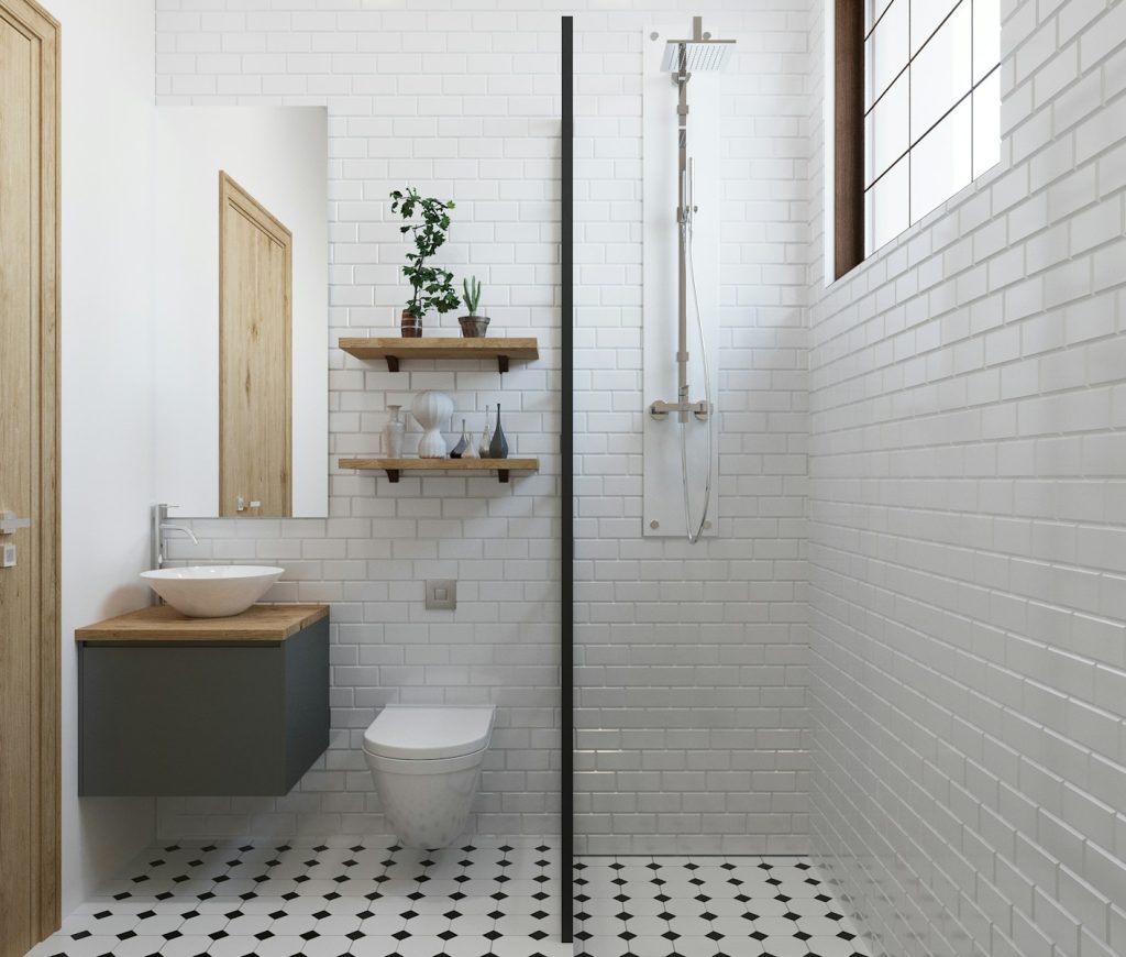 a bathroom with a black and white checkered floor